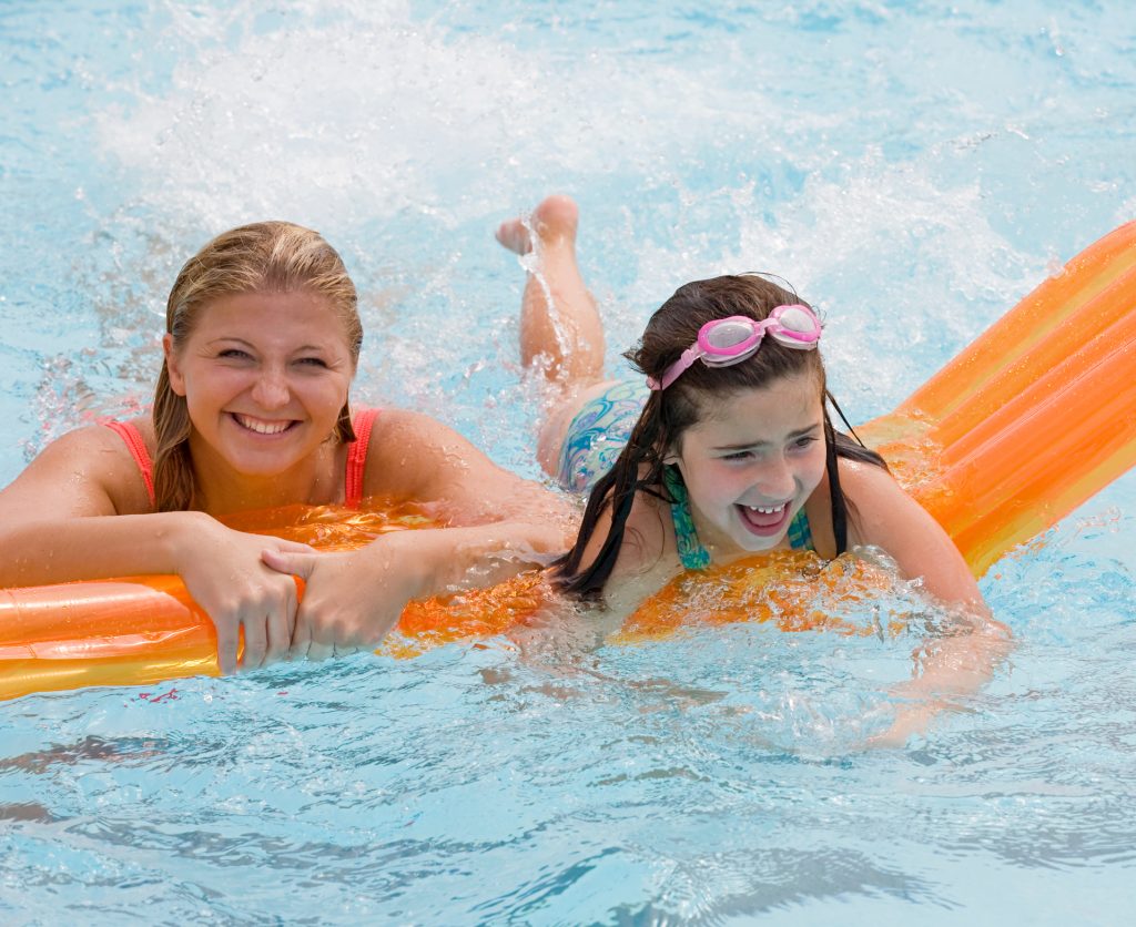 Swimming family having fun