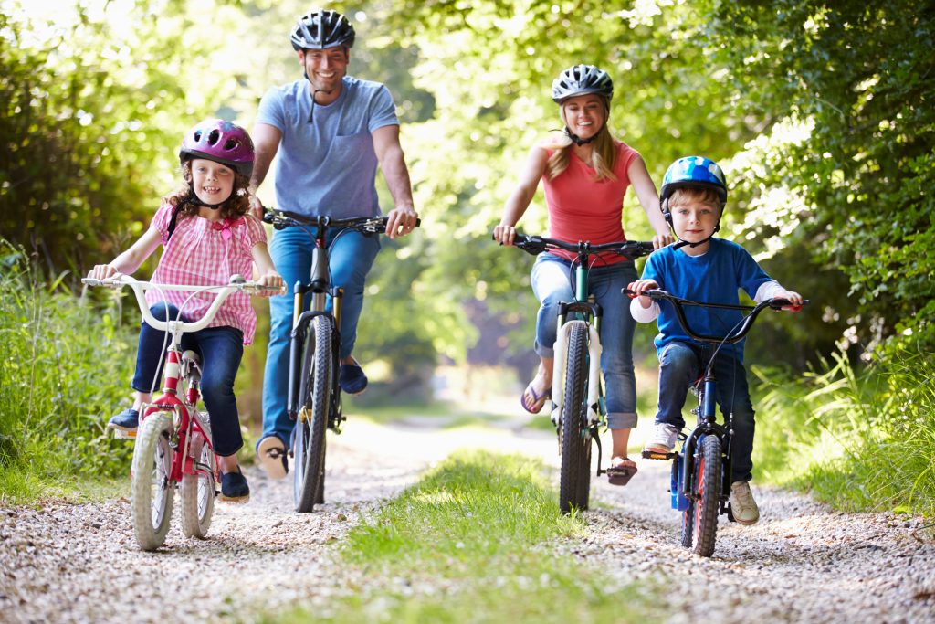 happy family riding bicycles